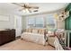 Cozy bedroom featuring a daybed, natural lighting, a ceiling fan, and comfortable décor at 3618 Berkeley Ct # Iv-A, Duluth, GA 30096