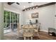 The dining area is adjacent to the kitchen and features a sliding glass door leading to the back patio at 3618 Berkeley Ct # Iv-A, Duluth, GA 30096