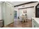 Dining area with a charming table set and a large window offering plenty of natural light and a view to the yard at 3618 Berkeley Ct # Iv-A, Duluth, GA 30096