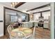 Spacious kitchen open to living and dining areas, featuring an eat-in island, and stainless appliances at 3618 Berkeley Ct # Iv-A, Duluth, GA 30096