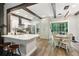 Bright eat-in kitchen with stainless steel appliances, breakfast bar, and sliding glass doors to the backyard at 3618 Berkeley Ct # Iv-A, Duluth, GA 30096