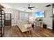 Bright living room showcasing hardwood floors, neutral furniture, and entertainment setup at 3618 Berkeley Ct # Iv-A, Duluth, GA 30096