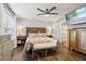 Comfortable primary bedroom with hardwood floors, ceiling fan, and stylish furniture at 3618 Berkeley Ct # Iv-A, Duluth, GA 30096