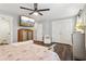 Relaxing main bedroom featuring a ceiling fan, flat-screen TV, and closet at 3618 Berkeley Ct # Iv-A, Duluth, GA 30096