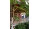 Wooden pergola adds architectural detail to this back porch with white railing and lush greenery at 604 Mead Se St, Atlanta, GA 30312