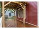 Inviting back porch with wood-stained floor, sturdy pergola, white railing, and exterior siding at 604 Mead Se St, Atlanta, GA 30312