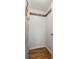 Minimalist basement with concrete floors, white wall, and coat rack with hardwood trim at 604 Mead Se St, Atlanta, GA 30312