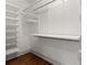 Walk-in closet with shelving and wooden floors, providing ample storage space at 604 Mead Se St, Atlanta, GA 30312