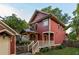 Charming two-story home with wood siding and a covered porch, enhanced by lush landscaping at 604 Mead Se St, Atlanta, GA 30312