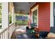 Relaxing front porch with a ceiling fan, stylish decor, and comfortable seating area at 604 Mead Se St, Atlanta, GA 30312