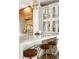 A closer view of the kitchen island with leather stools, modern lighting and stainless steel faucet at 604 Mead Se St, Atlanta, GA 30312