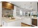 Modern kitchen with white cabinets, large island, wine cooler, and stainless steel appliances at 604 Mead Se St, Atlanta, GA 30312