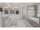 Main bath with dual sinks, tile floor and soaking tub adjacent to the shower at 7010 Beloit Pl, Roswell, GA 30075