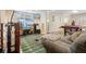 Basement living room with large TV, sectional seating, and pool table in the background at 7010 Beloit Pl, Roswell, GA 30075