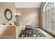 Cozy living room with neutral walls, lots of natural light, and an area rug at 7010 Beloit Pl, Roswell, GA 30075