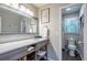 Well-lit bathroom featuring modern vanity, a stylish mirror, and adjacent toilet area at 111 John Christopher Dr, Alpharetta, GA 30009