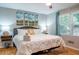 Comfortable bedroom with a large bed, decorative pillows, and plenty of natural light from the windows at 111 John Christopher Dr, Alpharetta, GA 30009