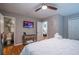 Cozy bedroom with modern ceiling fan, TV, closet and ensuite bathroom at 111 John Christopher Dr, Alpharetta, GA 30009