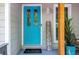 A charming turquoise front door with a 'Welcome' sign adds curb appeal at 111 John Christopher Dr, Alpharetta, GA 30009
