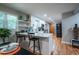 Updated kitchen featuring white cabinetry, stainless appliances, and convenient breakfast bar at 111 John Christopher Dr, Alpharetta, GA 30009