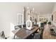 Open-concept dining area with hardwood floors and modern chandelier, flowing into kitchen at 1237 Memorial Se Dr # 404, Atlanta, GA 30316