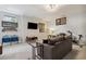 Finished basement with a large screen TV, comfortable seating, and exercise equipment at 243 Retreat Ln, Canton, GA 30114
