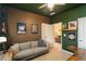 Stylish bedroom with an accent wall, modern decor, and a comfortable seating area at 243 Retreat Ln, Canton, GA 30114