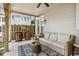 Relaxing covered patio with a bar area, outdoor seating, and a ceiling fan at 243 Retreat Ln, Canton, GA 30114