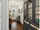 Inviting entryway with hardwood floors, built-in cabinet, and a view of the front door at 243 Retreat Ln, Canton, GA 30114
