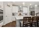 Bright kitchen featuring a large island with barstool seating and stainless steel appliances at 243 Retreat Ln, Canton, GA 30114