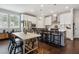 Bright kitchen with white cabinets, an island with seating, and stainless steel appliances at 243 Retreat Ln, Canton, GA 30114