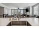 Open-concept kitchen view showcasing a large island and access to the well-lit living area at 243 Retreat Ln, Canton, GA 30114