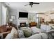 Cozy living room with fireplace, a large sofa, and an adjacent kitchen and dining area at 243 Retreat Ln, Canton, GA 30114