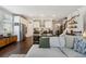 Open concept living room with kitchen, dining area, and a comfortable seating area at 243 Retreat Ln, Canton, GA 30114