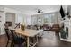 Sunlit living and dining area with hardwood floors, fireplace, neutral decor, and seamless flow at 243 Retreat Ln, Canton, GA 30114