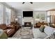 Inviting living room featuring a fireplace, comfortable seating, hardwood floors, and plenty of natural light at 243 Retreat Ln, Canton, GA 30114