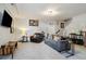 Comfortable living room with plush gray carpet, a gray sofa, and a leather armchair at 243 Retreat Ln, Canton, GA 30114