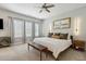 Serene main bedroom with plush carpet, neutral walls, modern lighting, and ample natural light at 243 Retreat Ln, Canton, GA 30114
