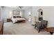 Large main bedroom features soft carpet, neutral walls, and a door to the en suite at 243 Retreat Ln, Canton, GA 30114