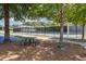 Community tennis courts are accessible with a picnic table under shady trees for spectators at 243 Retreat Ln, Canton, GA 30114