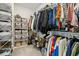 Bright walk-in closet with closet system for storing clothes, shoes and accessories at 243 Retreat Ln, Canton, GA 30114