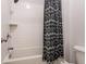 Bathroom featuring shower and tub combination with white subway tile and a decorative shower curtain at 2467 Davis Se Dr, Smyrna, GA 30080