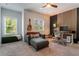 Comfortable bedroom featuring a cozy seating area, functional desk space, and modern decor, ideal for relaxation or work at 2467 Davis Se Dr, Smyrna, GA 30080