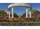 Smyrna Market Village entrance, showcasing beautiful landscaping and inviting architecture under a clear sky at 2467 Davis Se Dr, Smyrna, GA 30080