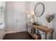 The entryway features a wood table, mirror, and hardwood floors at 2467 Davis Se Dr, Smyrna, GA 30080