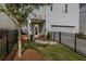Charming two-story home with gray siding, a garage, a fenced yard, and a welcoming front porch at 2467 Davis Se Dr, Smyrna, GA 30080