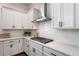 This kitchen features white cabinets, white countertops, and stainless steel appliances at 2467 Davis Se Dr, Smyrna, GA 30080