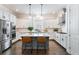 This kitchen features a large island, white cabinets, and stainless steel appliances at 2467 Davis Se Dr, Smyrna, GA 30080