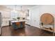 Modern kitchen with white cabinets, stainless steel appliances, and an island with seating at 2467 Davis Se Dr, Smyrna, GA 30080