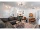 Open concept living room showcasing hardwood floors, modern lighting, and comfortable seating at 2467 Davis Se Dr, Smyrna, GA 30080